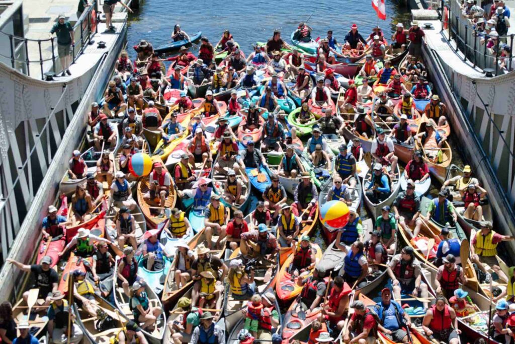 Hundreds of paddlers gather with their canoes in the Peterborough locks.