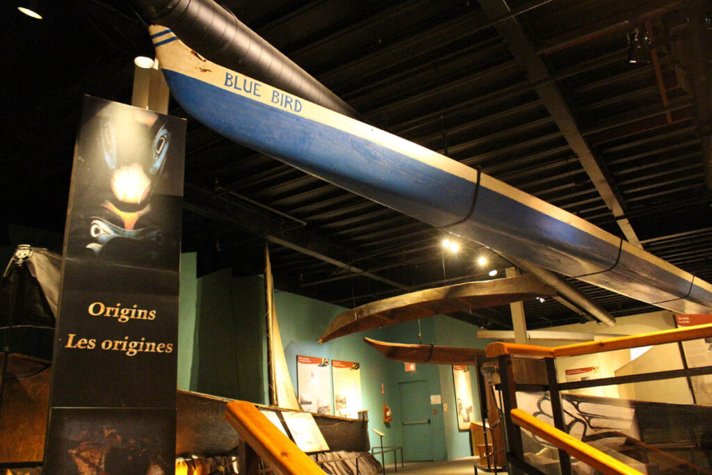 A blue canoe hangs from the ceiling.