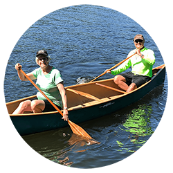 Jim & Kate Steward paddling in a canoe