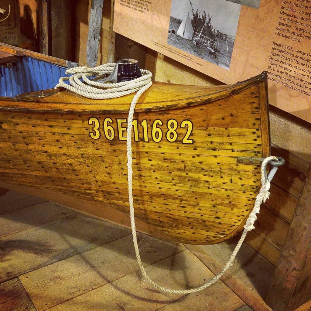 Bow of a wooden canoe with rope