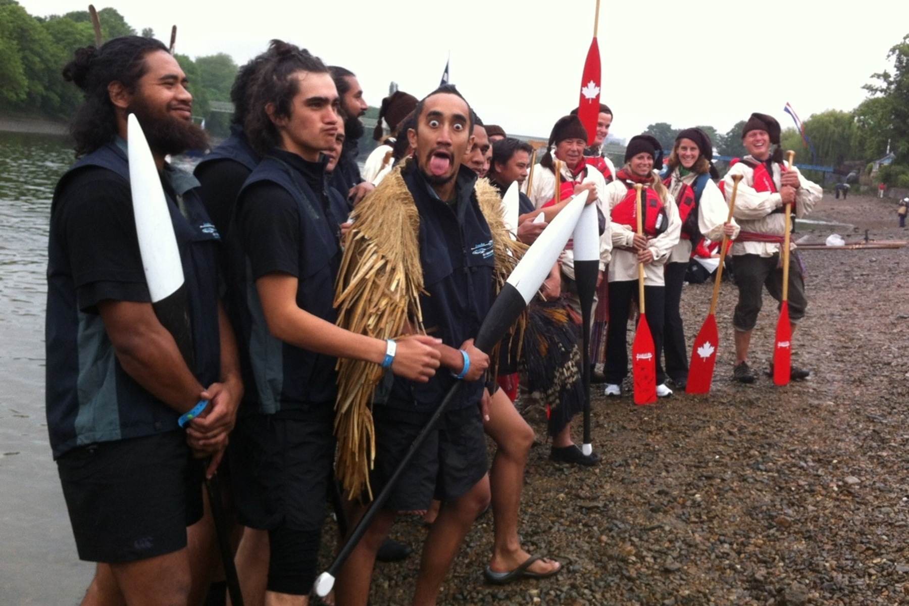 The Maori team and Canada One team stand and pose for a picture