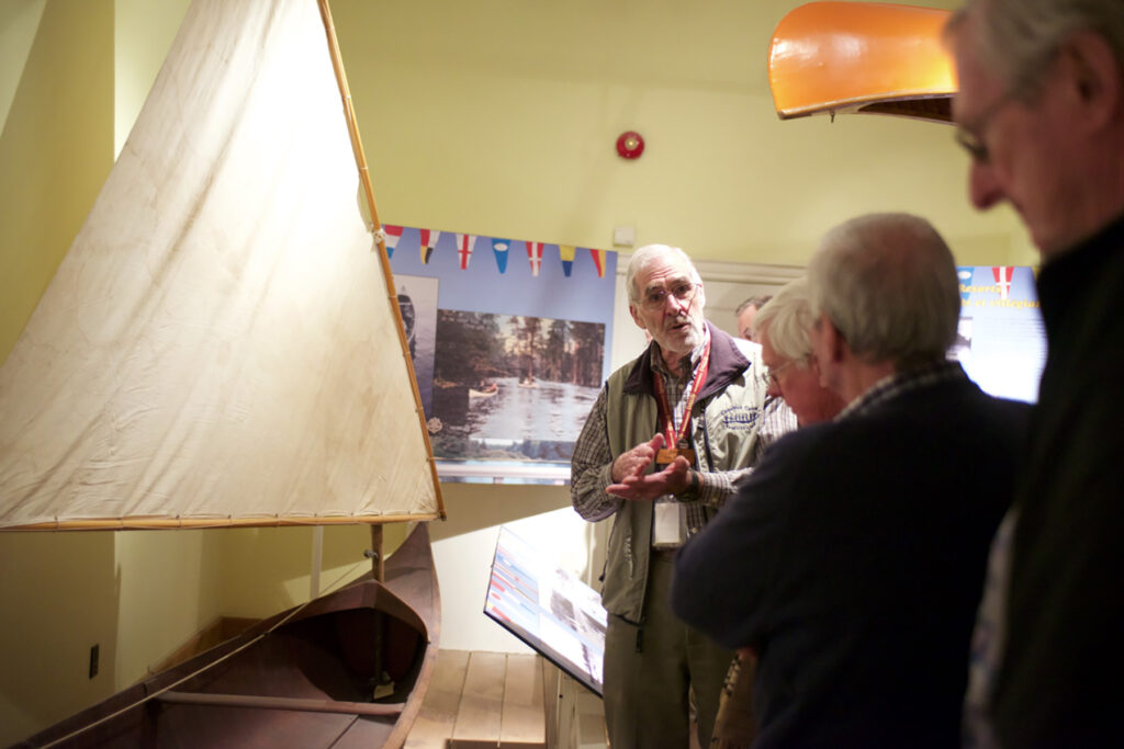 A volunteer docent leads an exhibit tour at The Canadian Canoe Museum.