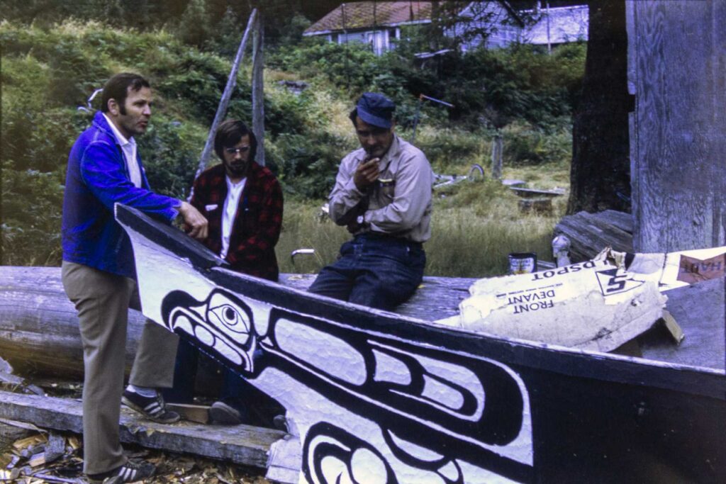 Kirk Wipper and Victor Adams stand beside the Eagle Canoe Masset.