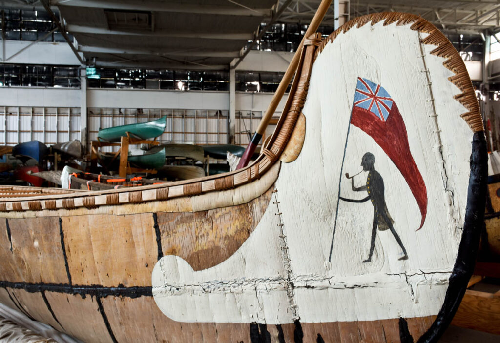 A close-up image of detailed painting on a canoe.