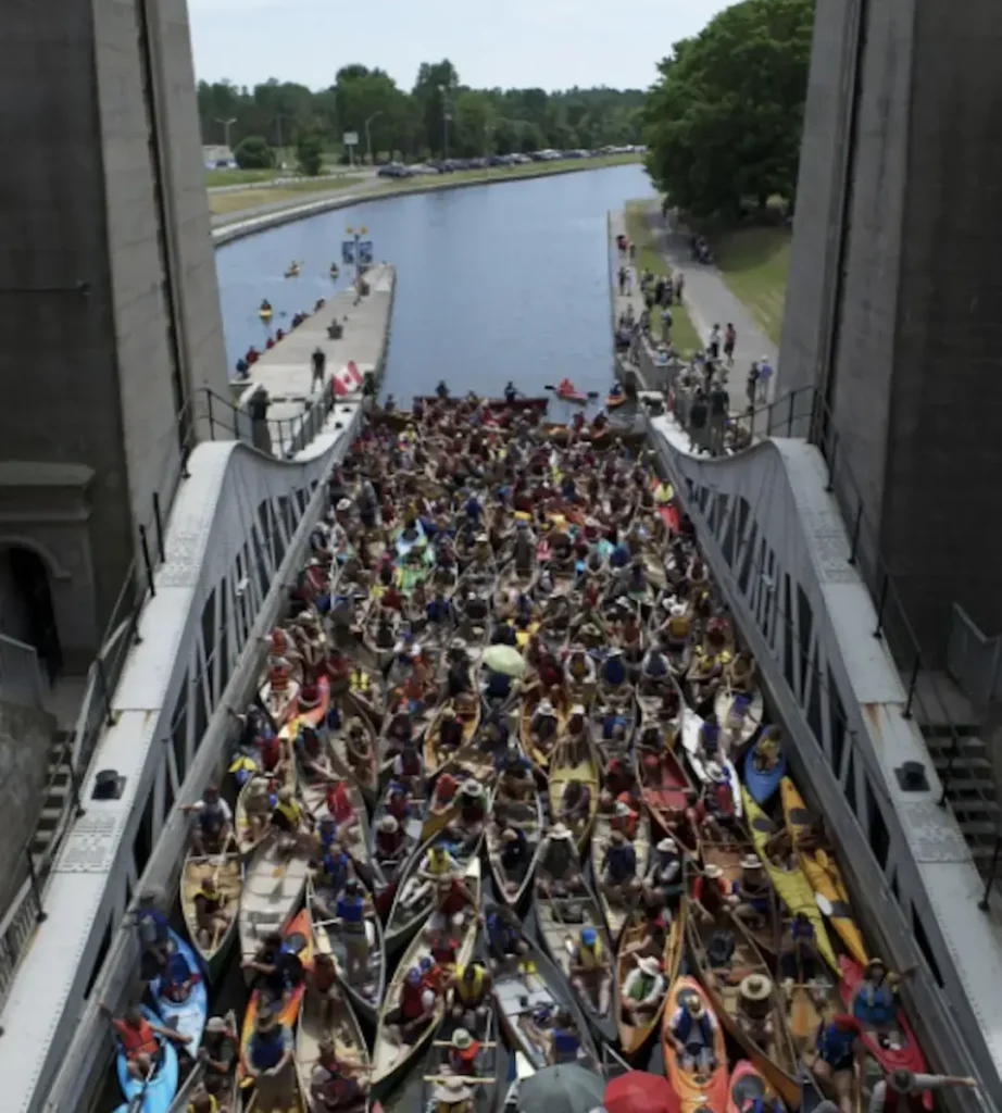 Hundreds of paddlers gather with their canoes in the Peterborough locks.
