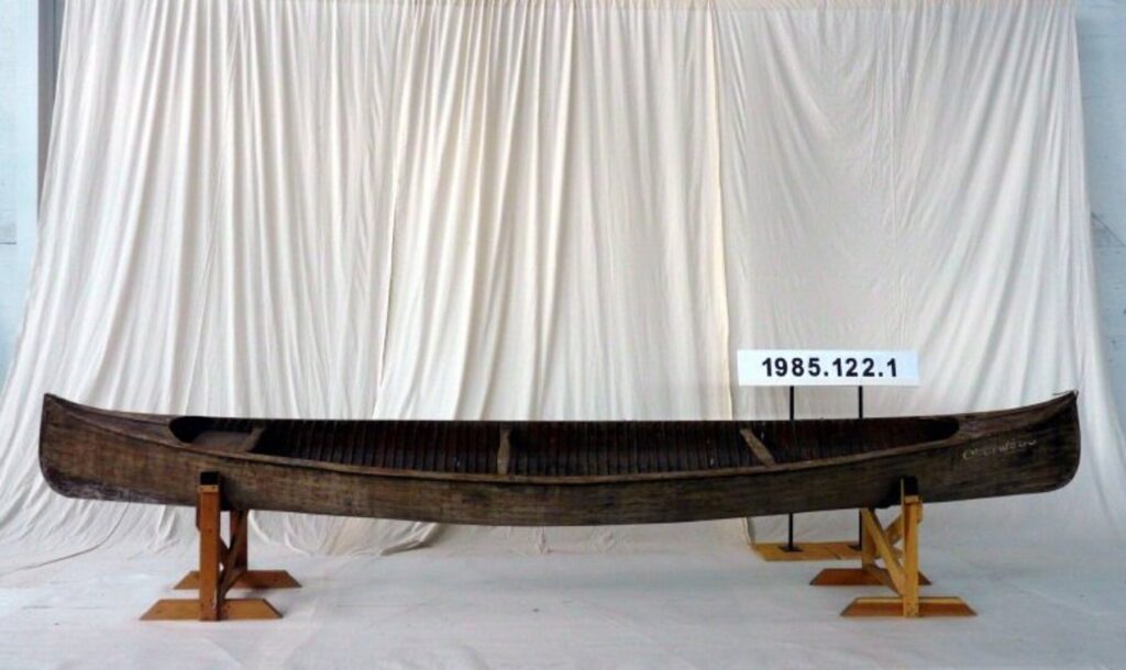 Longitudinal Strip Canoe "Overwego" on display in front of white drop sheet