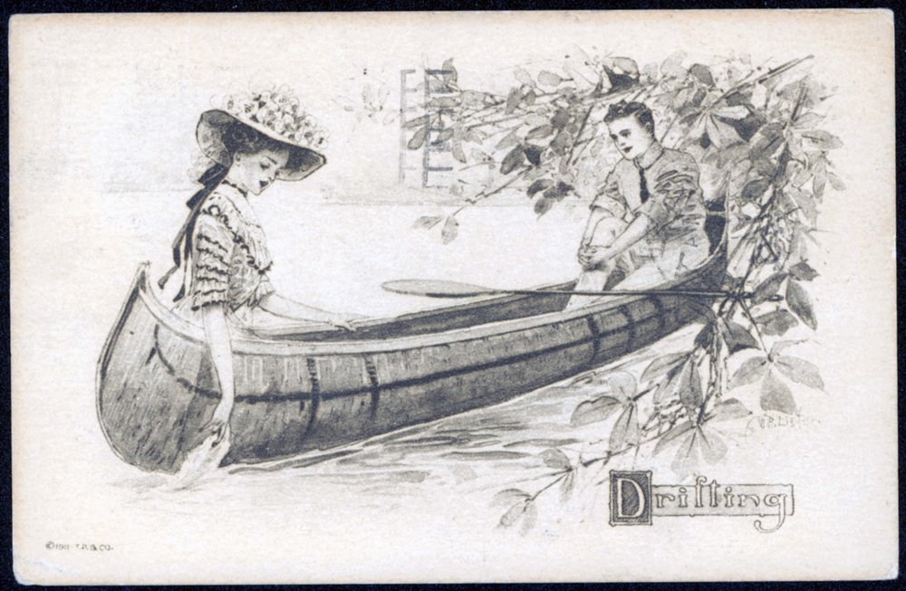 Black and white postcard of a sketched canoe with a man and woman afloat, surrounded by a tree branch of budding flowers.