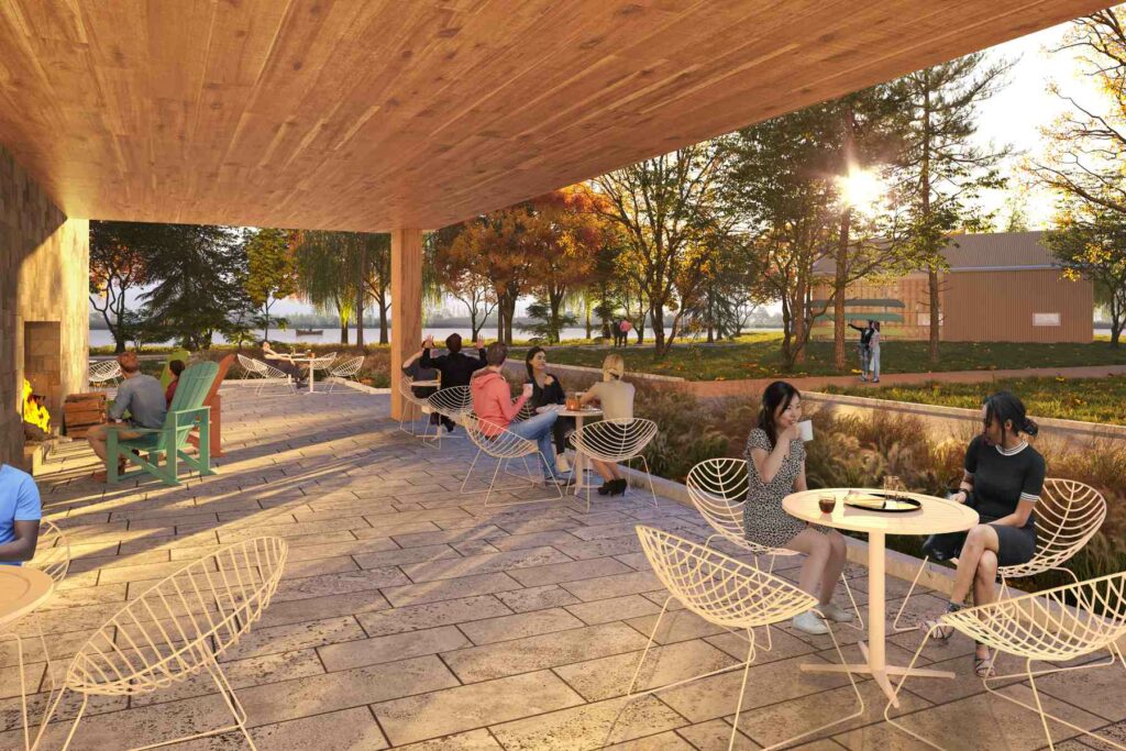 A conceptual render of the outdoor terrace. Visitors sip at their coffee, converse, and enjoy the outdoor fireplace. In the background, visitors are also enjoying the Trans Canada Trail and lakefront.